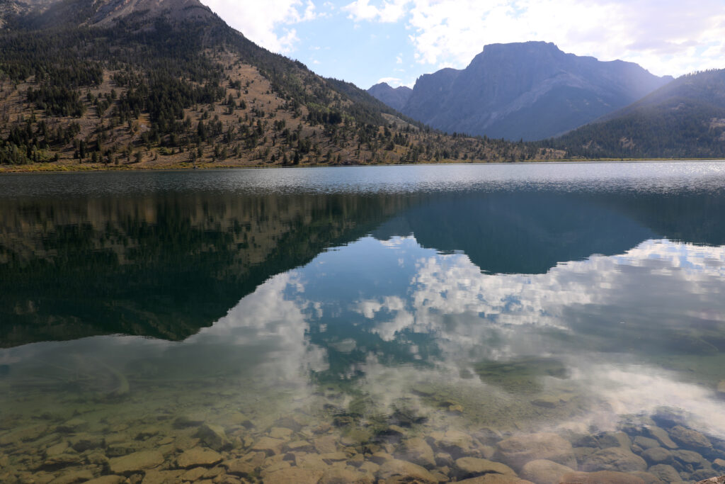 mountains reflecting in lake