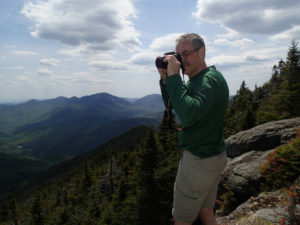 photographer taking photos of the mountains